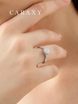 Lifestyle view of a model wearing a vintage floral-inspired diamond ring.
