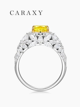 Side view of a vintage yellow diamond ring showcasing the intricate tiered halo setting.