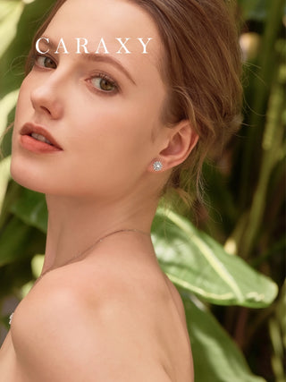 A women wear a round diamond floral halo earrings lifestyle photo.
