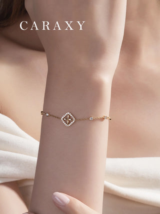 woman wearing four-leaf clover halo diamond bracelet on wrist